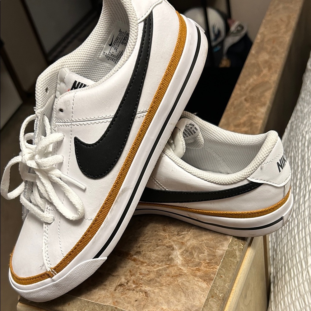 Nike White Sneakers with Black and Gold Details